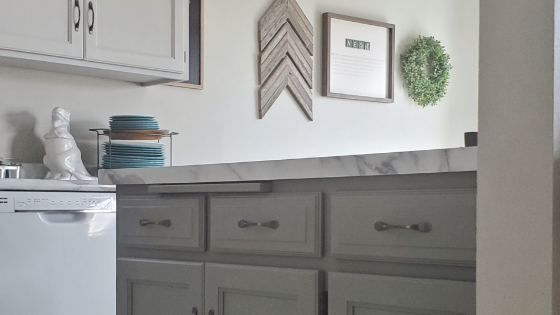 Refresh your cabinets with paint!  In this kitchen General Finishes milk paint was used in light gray, Seagull Gray, and dark gray, perfect gray.